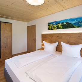 Chalet: Schlafzimmer mit Doppelbett - Niederauer Hof Chalets