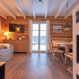 Chalet: Wohn- und Essbereich Premium Lodge / Premium Lodge Plus - Das Schierke Harzresort