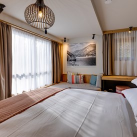 Chalet: Schlafzimmer im Untergeschoss - Hideaway Hotel Montestyria Chalets & Suiten