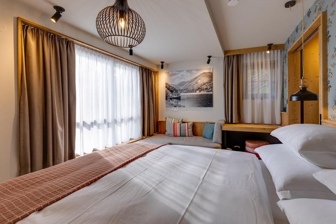 Chalet: Schlafzimmer im Untergeschoss - Hideaway Hotel Montestyria Chalets & Suiten
