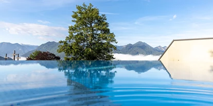 Hüttendorf - Parkplatz direkt an der Hütte - Steiermark - Pool mit Ausblick - Hideaway Hotel Montestyria Chalets & Suiten