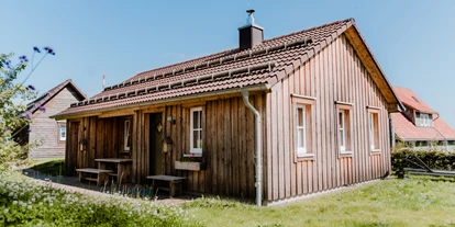 Hüttendorf - PLZ 38871 (Deutschland) - Kuschel Lodge mit Himmelbett, freistehender Badewanne, Kamin, Sauna und eigenen Whirpool.  - Torfhaus HARZRESORT