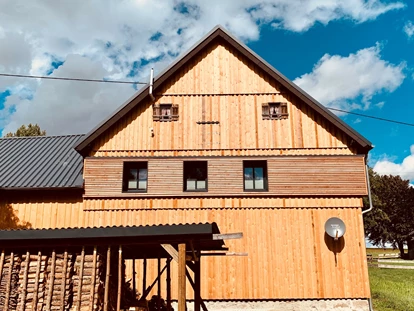 Hüttendorf - Whirlpool: beim Chalet - Scheunenloft - bis 4 Personen 
Außenansicht - Das MUSSEA Landhaus Chalet & Scheunenloft