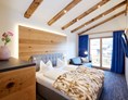 Chalet: Schlafzimmer mit Doppelbett - Chalets Hubertus 
