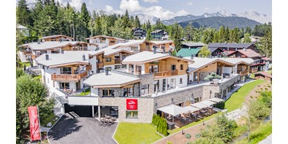 Hüttendorf - Massagen: im Hauptgebäude - AlpenParks Chalet & Apartment Alpina Seefeld