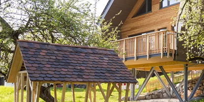 Hüttendorf - Baden-Württemberg - Außenansicht/Sandkasten - Streuobst Chalets
