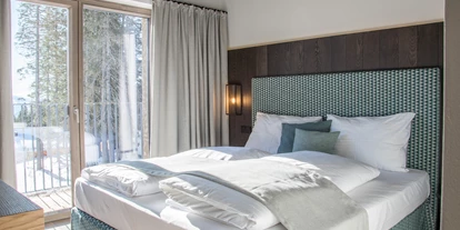 Hüttendorf - Weng (Goldegg) - Gemütliche Boxspring-Doppelbetten sorgen für einen angenehmen Schlaf - Kauz - Design Chalets