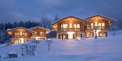 Hüttendorf - Skiraum: im Hauptgebäude - Chalet´s bei Nacht - Chalet´s und Hotel Mariasteinerhof - Weitblickchalets