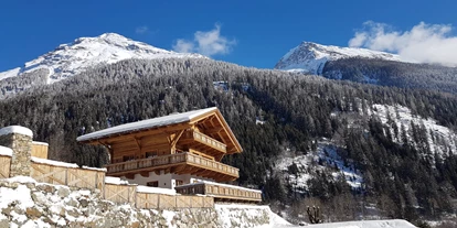 Hüttendorf - Weng (Goldegg) - Winteransicht des Grand Chalets - Hideaway Eggerfeld