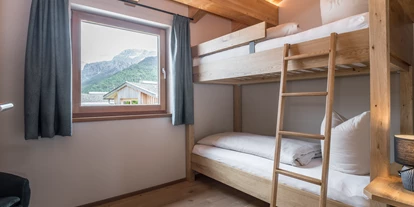 Hüttendorf - Weng (Goldegg) - Stockbettzimmer im Premium XL Chalet Main Lodge - ALPEGG CHALETS
